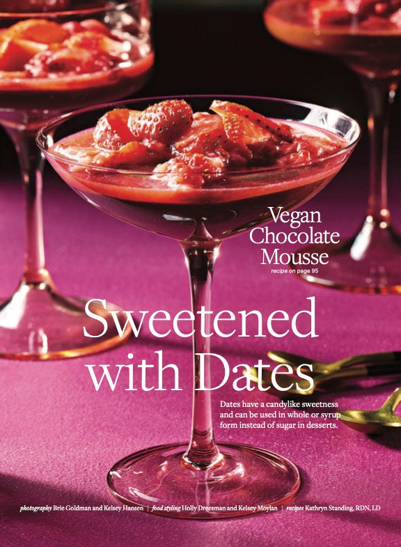First page of the Sweetened with Dates feature, showing a long stemmed glass filled with Vegan Chocolate Mousse