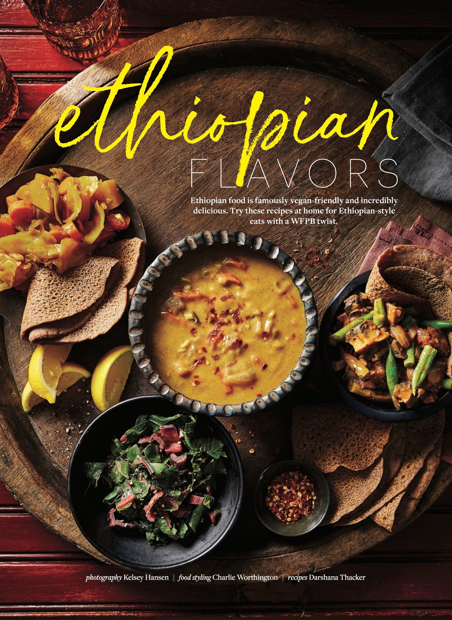 A large round wooden platter of vegan Ethiopian food