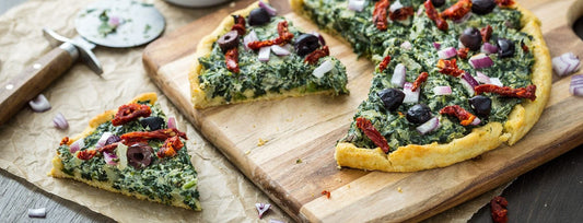 Pizza with Creamed Spinach, Sun-Dried Tomatoes, Red Onion, and Olives