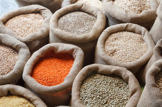 large sacks of various whole grains and legumes
