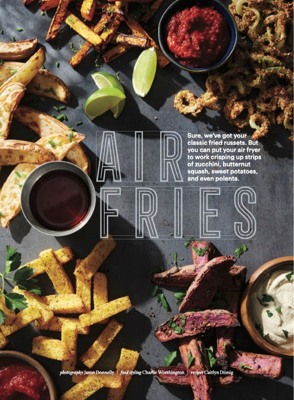 Air Fries spread with different veggies and small bowls of dipping sauce